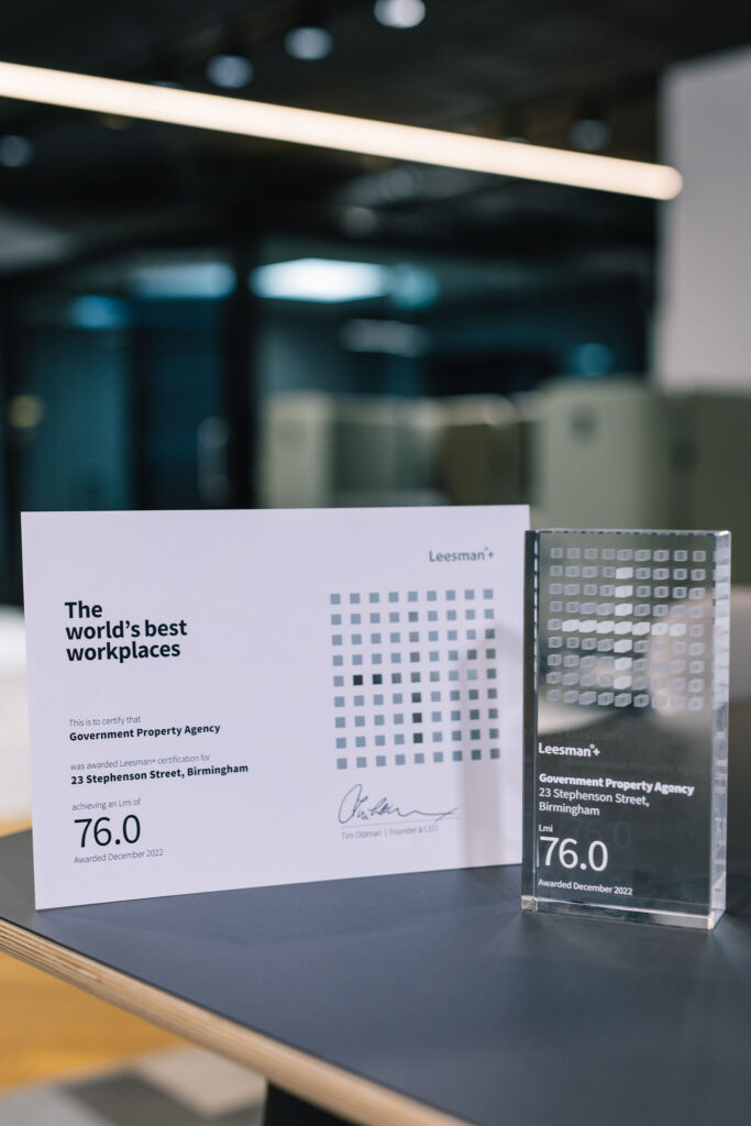 This is a landcape photo of the certificate (left) showing the GPA's workplace received a score of 76. It includes the Leesman plus icon and is certififed by Leesman's CEO and Founder, Tim Oldman. The Leesman plus tropy is on the right stating the same details as the certificate.